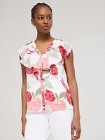 Blouse boutonnée sans manches à volants et motif fleuri