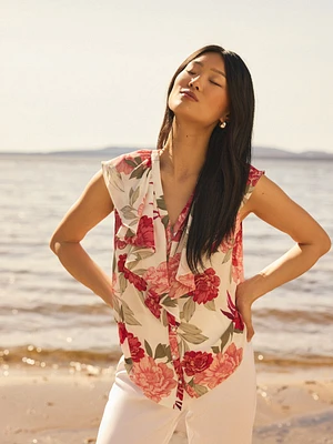 Blouse boutonnée sans manches à volants et motif fleuri