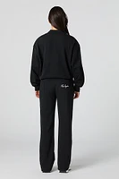 Pantalon d'entraînement Active en molleton avec motif brodé LA