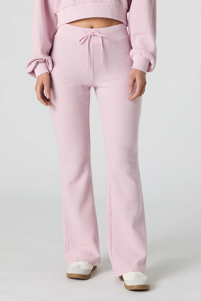 Pantalon en molleton tricot gaufré à jambe évasée