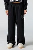 Pantalon d'entraînement à jambe large en molleton avec motif