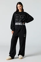 Pantalon d'entraînement à jambe large en molleton avec motif