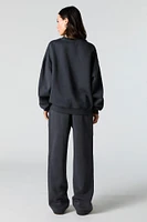 Pantalon d'entraînement à jambe large en molleton avec motif