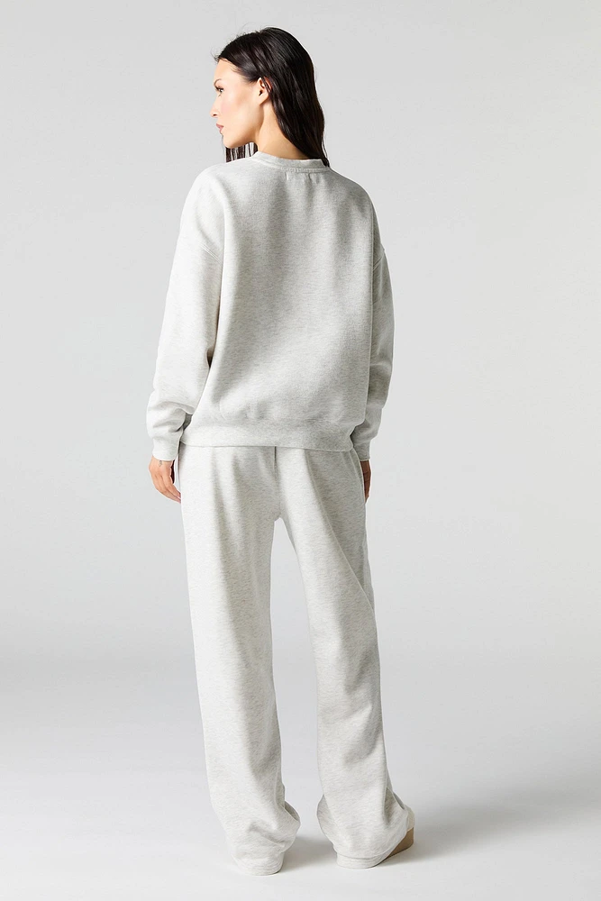 Pantalon d'entraînement à jambe large en molleton avec motif