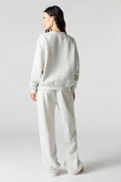 Pantalon d'entraînement à jambe large en molleton avec motif