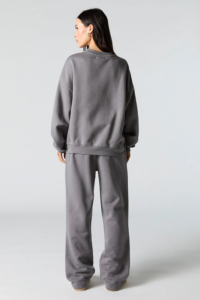 Pantalon d'entraînement à jambe large en molleton avec motif