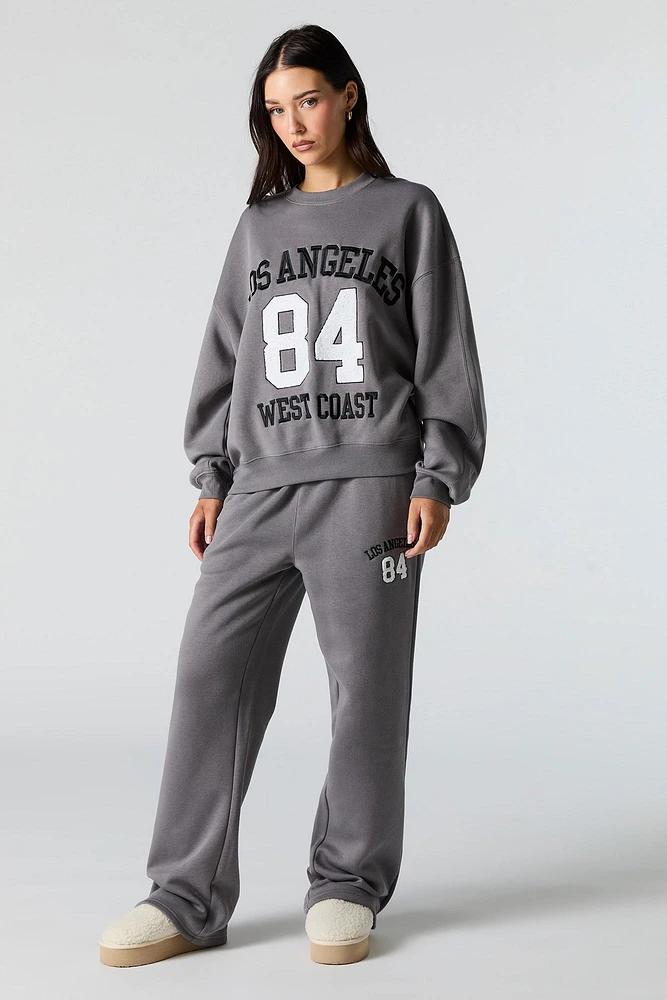 Pantalon d'entraînement à jambe large en molleton avec motif