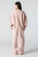 Pantalon d'entraînement à jambe large en molleton avec motif