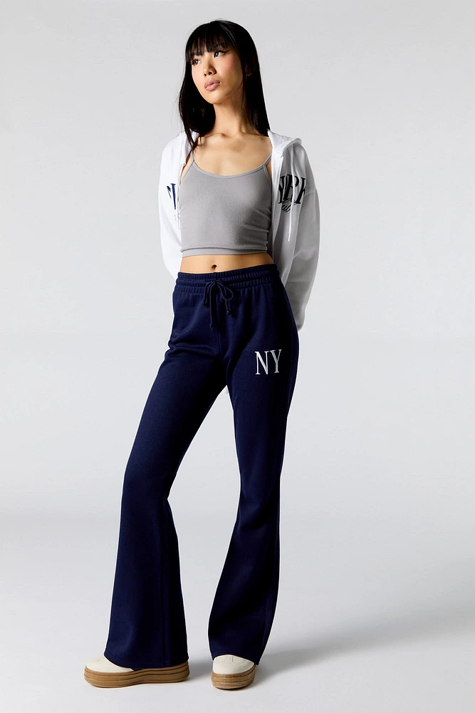 Pantalon d'entraînement à jambe évasée en molleton avec motif brodé