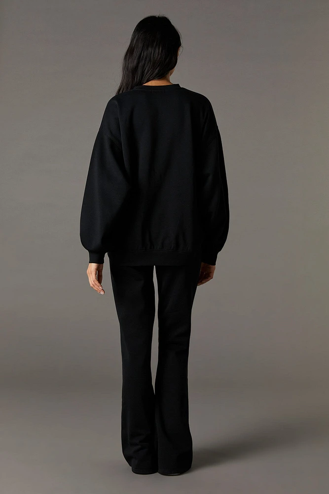 Pantalon en molleton jambe évasée à imprimé Playboy