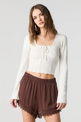 Short à taille élastique avec bordure en dentelle