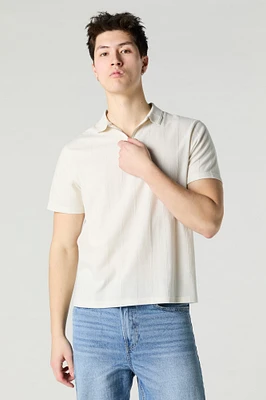 Polo texturé avec fermeture à glissière