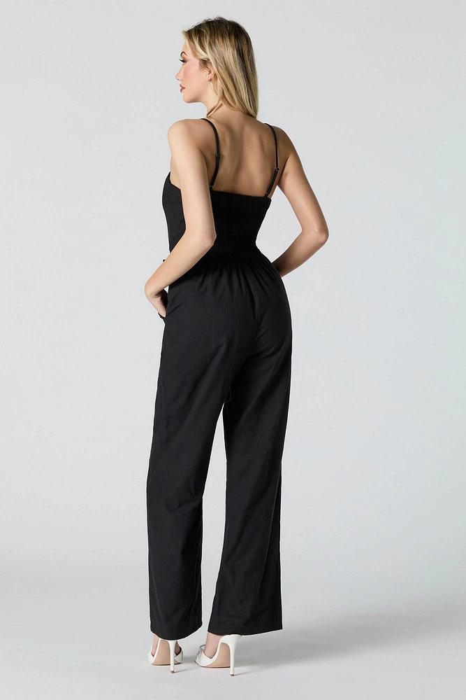 Combinaison jambe large avec ceinture et devant boutonn