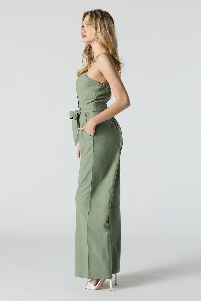 Combinaison jambe large avec ceinture et devant boutonn