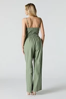 Combinaison jambe large avec ceinture et devant boutonn