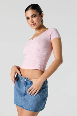 Haut en tricot pointelle et rosette à bordure dentelle