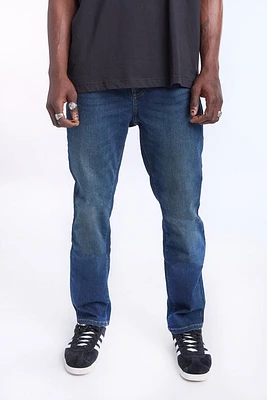 Jean délavé fonce à jambe droite homme