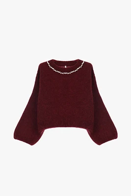 Pull ras du cou orné de bijoux