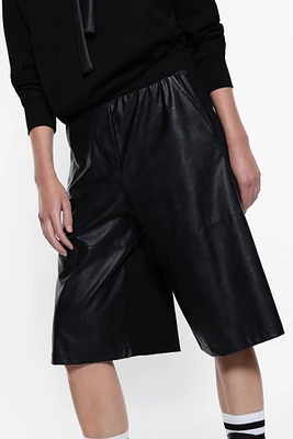 Knee-length shorts faux leather and fabric