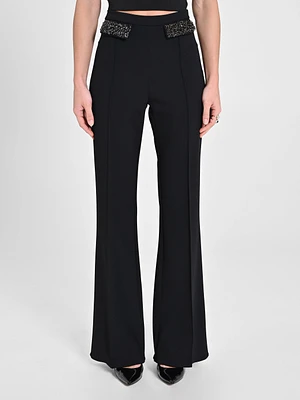 Pantalon avec rabats de poche ornés bijoux