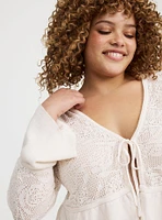 POINTELLE RUFFLE HEM TIE FRONT CARDIGAN