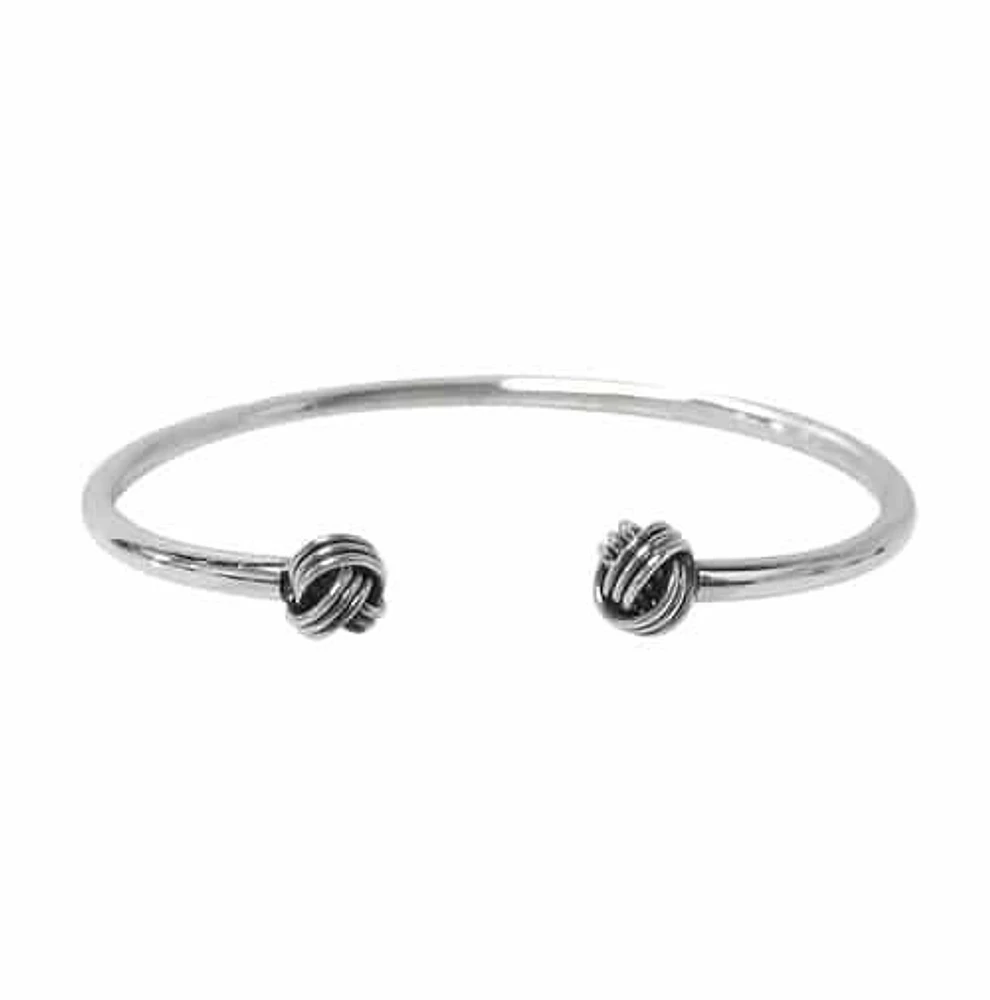 Sterling Silver Cuff Bangle With 7mm Love Knot Charm. Approximate Bar Size: 3mm Thickness