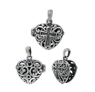 Sterling Silver, Heart Shape Locket With Cross And Filigree Design. Approx Size: 15mm L X 15mm W X 7.5mm T