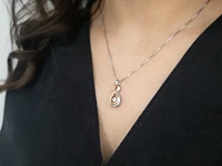 Sterling Silver and 10K Rose Gold 0.18cttw Canadian Diamond Pendant, 18"