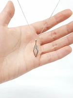 10K White and Rose Gold 0.08cttw Diamond Pendant, 18"