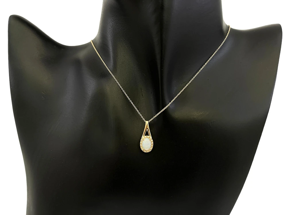 10K Yellow Gold 7x5mm Oval Cut White Opal and 0.08cttw Diamond Halo Pendant - 18 Inches