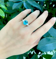 14K White Gold 10mm x 8mm Blue Topaz and 0.216cttw Canadian Diamond Ring