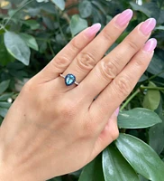 10K White Gold 7x5mm Pear Cut Sky Blue Topaz with Blue Sapphire Halo and 0.10cttw Diamond Ring - Size 7
