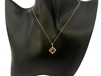 10K Yellow Gold 5mm Round Cut Garnet and 0.09cttw Diamond Pendant - 18 inches