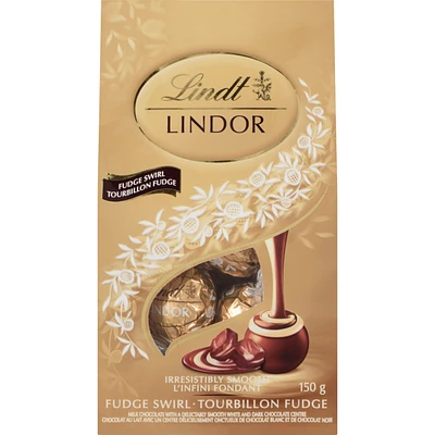 Milk Chocolate With A Delectably Smooth White And Dark Chocolate Centre Fudge Swirl