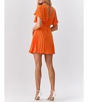 Adelyn Rae Pleated V-Neck Short Flutter Sleeve Twist Front Mini Dress