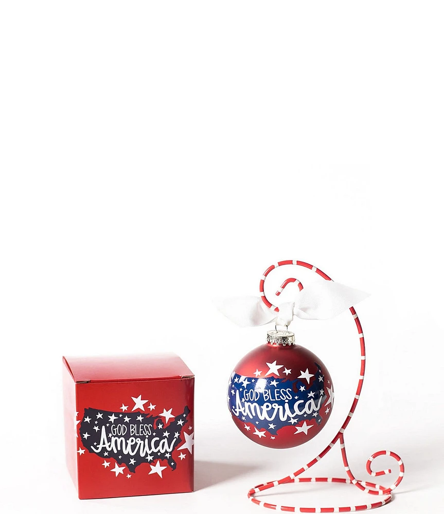 Coton Colors God Bless America Glass Ornament with Red and White Swirl Stand Set