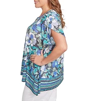 Ruby Rd. Plus Size Jersey Knit Floral Stripe Border Print Round Neck Short Sleeve Sharkbite Hem Top