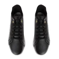 Tenis Aitana color negro con firma Dorothy Gaynor y detalle dorado