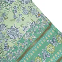 Pantalón acampanado color verde con flores para mujer