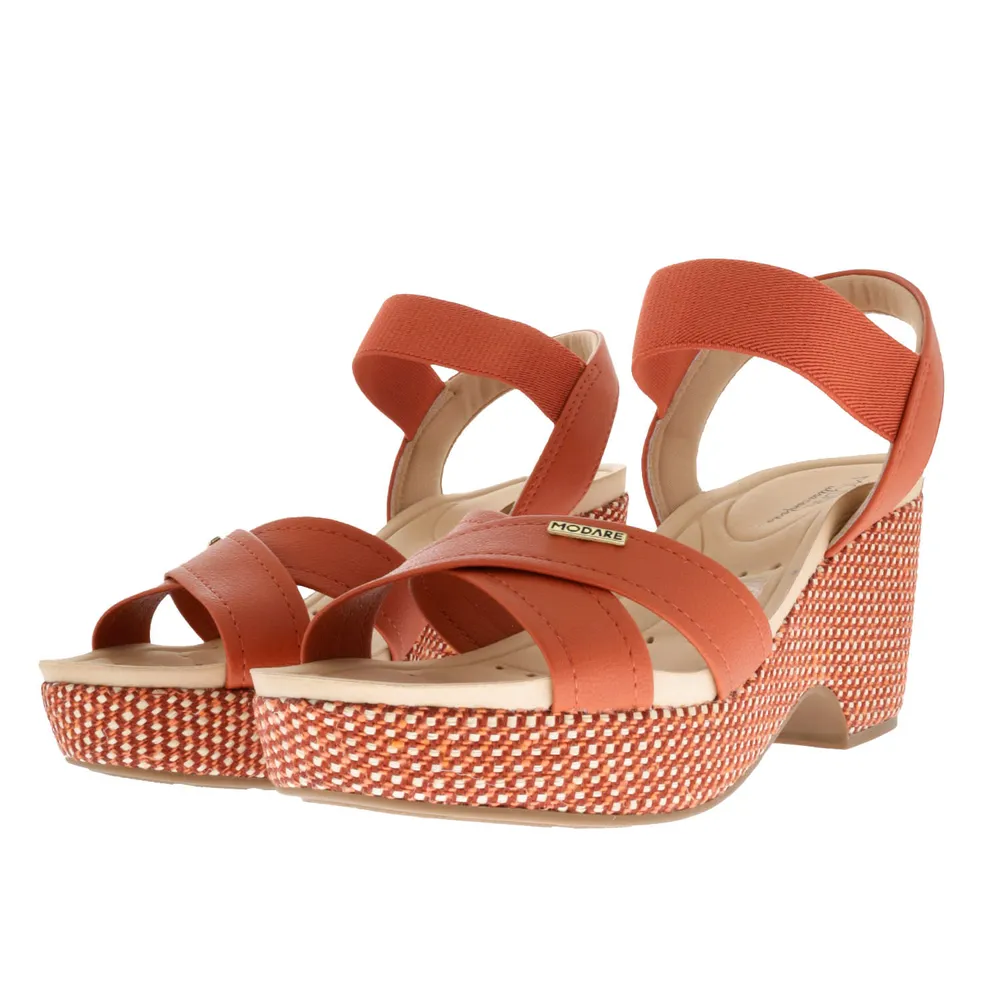 Sandalias Paulette color naranja con resorte y trenzado en suela