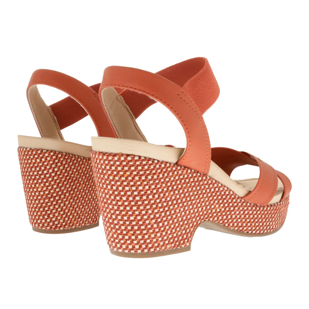 Sandalias Paulette color naranja con resorte y trenzado en suela