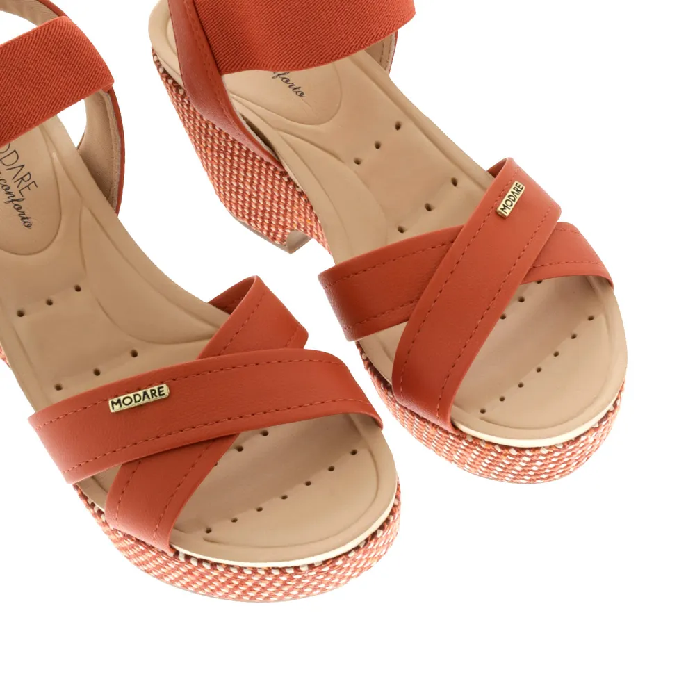 Sandalias Paulette color naranja con resorte y trenzado en suela