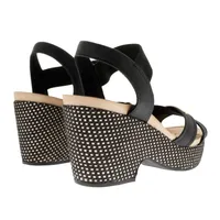 Sandalias Paulette color negro con resorte y trenzado en suela