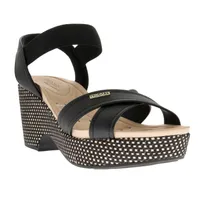 Sandalias Paulette color negro con resorte y trenzado en suela