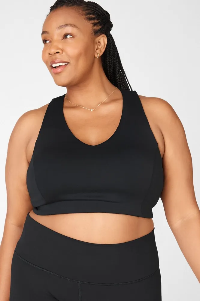 Standard sports bra from the front, major strap party from the back. Mix up  your routine in our mediu…