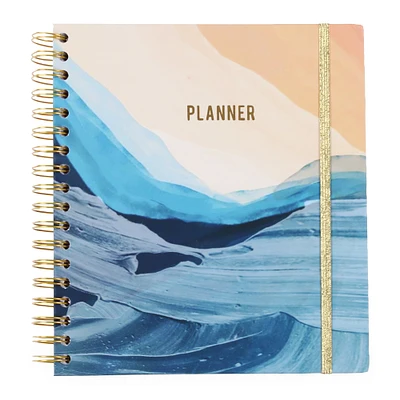 spiral-bound monthly planner