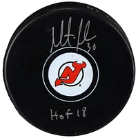 Martin Brodeur New Jersey Devils Autographed Hockey Puck with HOF 18 Inscription