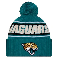 Youth New Era Teal Jacksonville Jaguars 2024/25 Sideline Cuffed Knit Hat with Pom