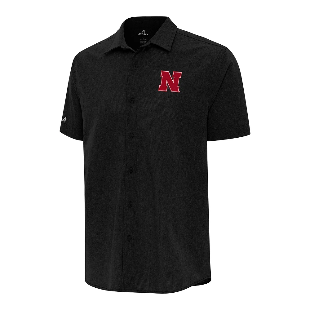 Men's Antigua Black Nebraska Huskers Activate Woven Short Sleeve Button-Down Shirt