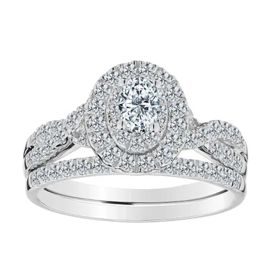 .23 CARAT OVAL CENTRE, 1.00 TOTAL DIAMOND HALO ENGAGEMENT RING SET, 14kt WHITE GOLD.......................NOW